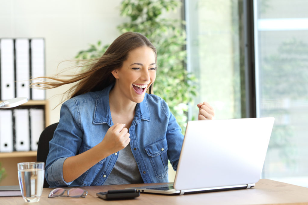 A female app user showing happiness because of fast app speed.