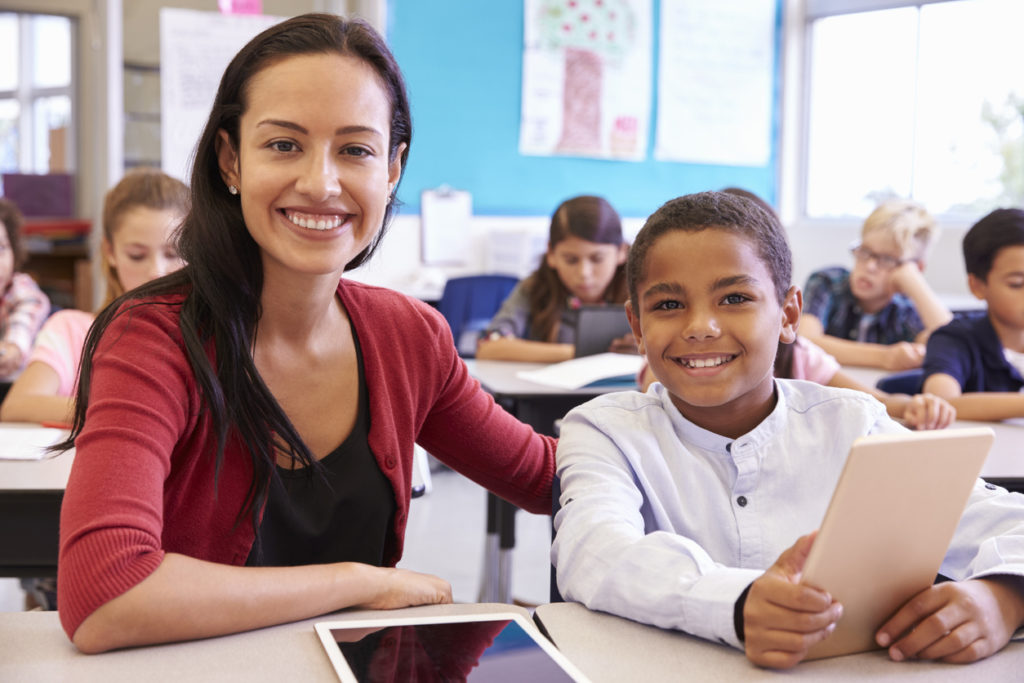 An educator in the classroom; ed-tech; custom data warehouses.